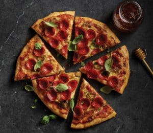 Sweet and Spicy Basil HORMEL® Pepperoni Cup N’ Crisp Pizza with Hot Honey